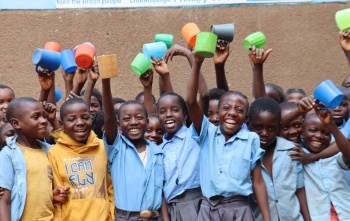 Zambia group of children with a mug