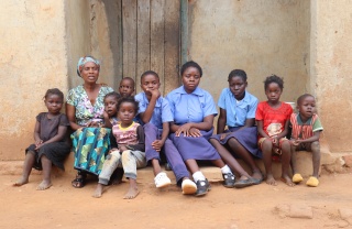 Euphrasia and grandchildren at home