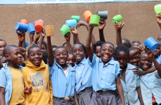 Zambia group of children with a mug