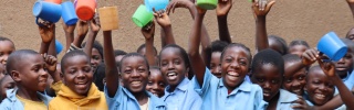 Zambia group of children with a mug