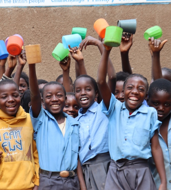 Zambia group of children with a mug