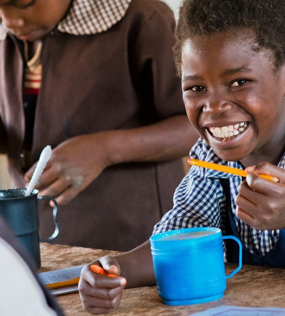 Child Eating Marys Meal Food in a School