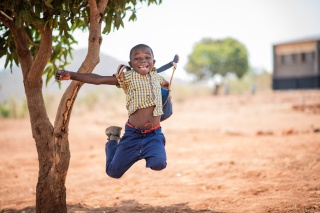 Boy jumping happily