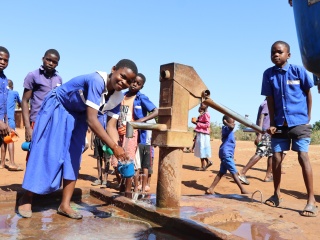 Chigodi Primary School - Malawi_Handwashing after eating porridge