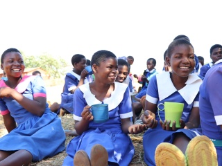 Chigodi Primary School_Malawi_A group of girls eating porridge
