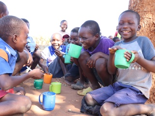 Chigodi Primary School_Malawi_Boys enjoying their porridge