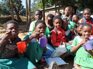 Children enjoying their porridge